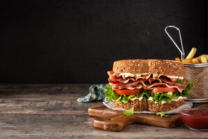 Blt,Sandwich,With,Bacon,lettuce,And,Tomato,On,Wooden,Table.,Copy